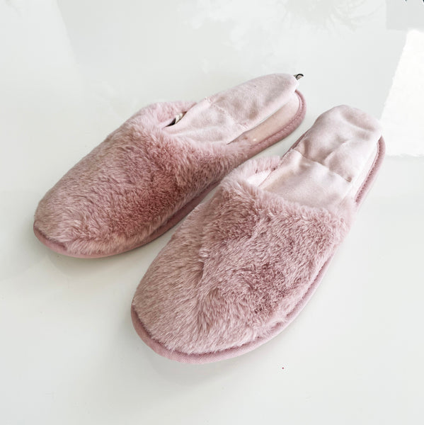 slipper slide on light pink white background